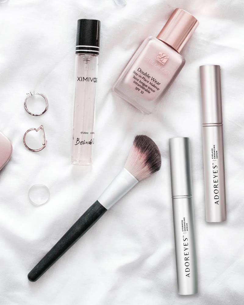 Makeup items laid out on silk fabric