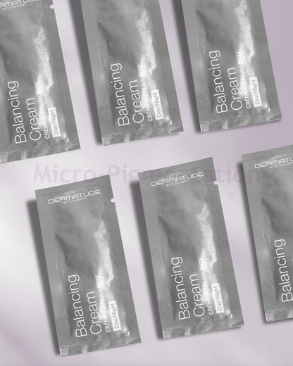 six rectangular grey packets placed beside each other in a line 